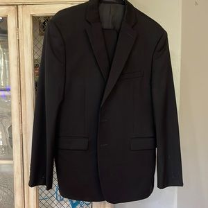 Calvin Klein Suit. Minor damage on sleeve. Black